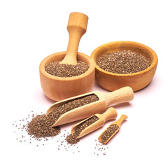 Wooden scoop of organic natural chia seeds close-up isolated on white background