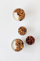 Homemade breakfast granola with nuts and raisins. Healthy food.
Copy space. Top view.