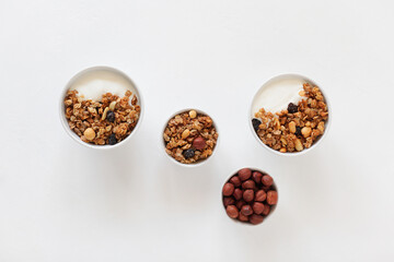 Homemade breakfast granola with nuts and raisins. Healthy food.
Copy space. Top view.
