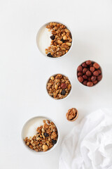 Homemade breakfast granola with nuts and raisins. Healthy food.
Copy space. Top view.