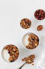 Obraz na płótnie Canvas Homemade breakfast granola with nuts and raisins. Healthy food. Copy space. Top view.