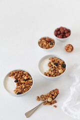 Homemade breakfast granola with nuts and raisins. Healthy food.
Copy space.