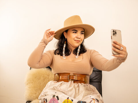 Young Indigenous female model indoors