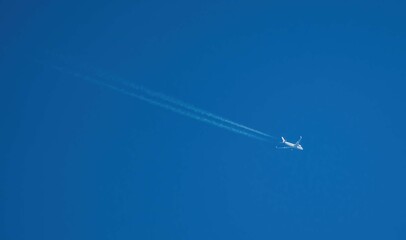 Airplane trail on blue sky