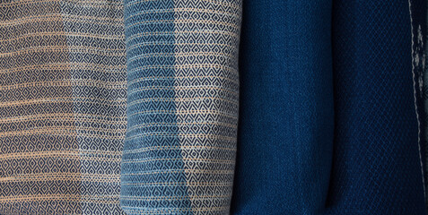 Roll of hand woven shawls, Thai cotton indigo dyed. Textile texture