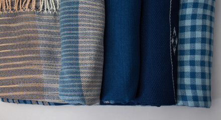 Roll of hand woven shawls, Thai cotton indigo dyed. Textile texture