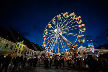 Colored Ferris Wheel at Christmas Market on a calm night