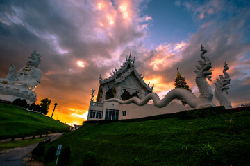 public attraction background A temple in Chiang Rai (Wat Huay Pla Kang), with a large statue. Popular people come to make merit from all over the world in Thailand. - obrazy, fototapety, plakaty