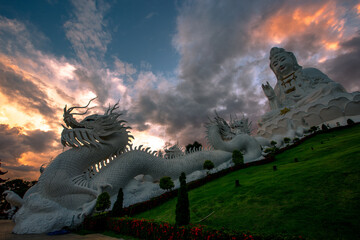 public attraction background A temple in Chiang Rai (Wat Huay Pla Kang), with a large statue....