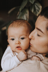 Peaceful loving home atmosphere, baby in mom's arms