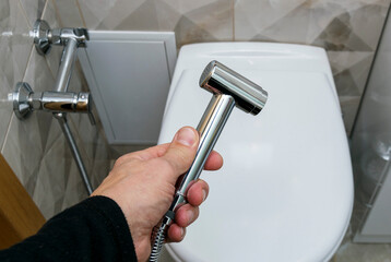 The bidet. shower for hygiene and cleansing the body with water.The concept of cleanliness and...