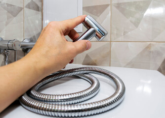 The bidet. shower for hygiene and cleansing the body with water.The concept of cleanliness and...
