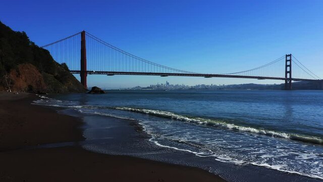 Golden Gate Bridge and beach along the Pacifica Ocean in the San Francisco Bay Area.