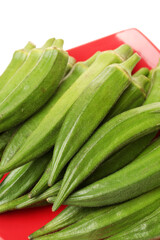 Fresh young okra isolated on white background
