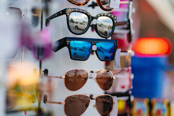 counter with sunglasses. sale of goods for tourists 