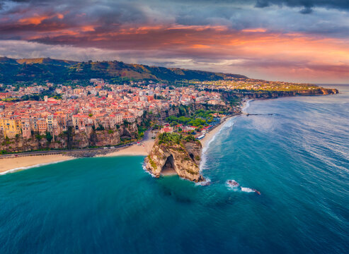 Gloomy morning cityscape of Tropea town before the rain, Italy, Europe. Dramatic summer scene of east coast of Calabria. Traveling concept background.