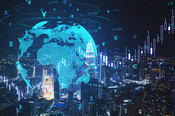 Creative globe hologram with money signs and candlestick graph on blurry night city background. Global trade, finance, currency and future concept. Double exposure.
