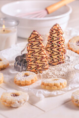 Christmas gingerbread and cookies with baking ingredients in white