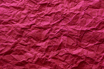 Crinkled red paper texture as a background.