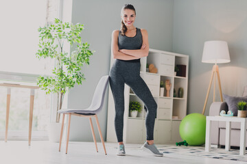Photo of adorable confident lady wear sport outfit smiling arms crossed indoors home house