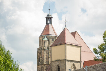 Fototapeta na wymiar European stone church backed by cloudy sky