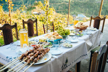 Georgian feast on the vineyard at sunset