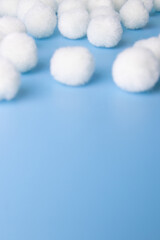 White Pom-Pom on Blue Background