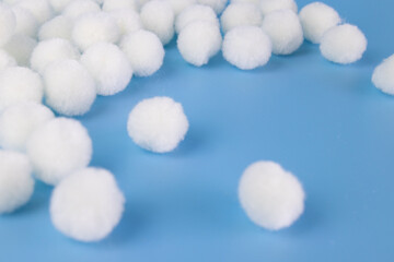 White Pom-Pom on Blue Background