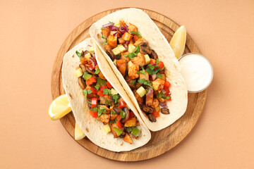Concept of tasty food with taco on beige background