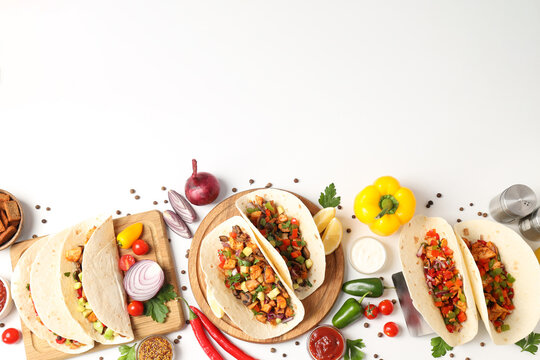 Concept of tasty food with taco on white background