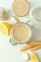Concept of tasty food with tahini sauce on white background