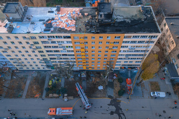 Severe fire in a residential multi-storey building. Photos from the drone. The roof of the building is on fire.