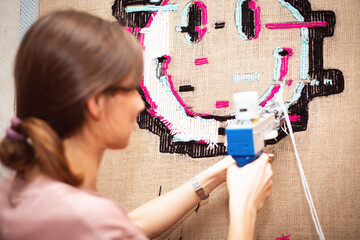 The process of making tufting carpet smile handmade to order at home.