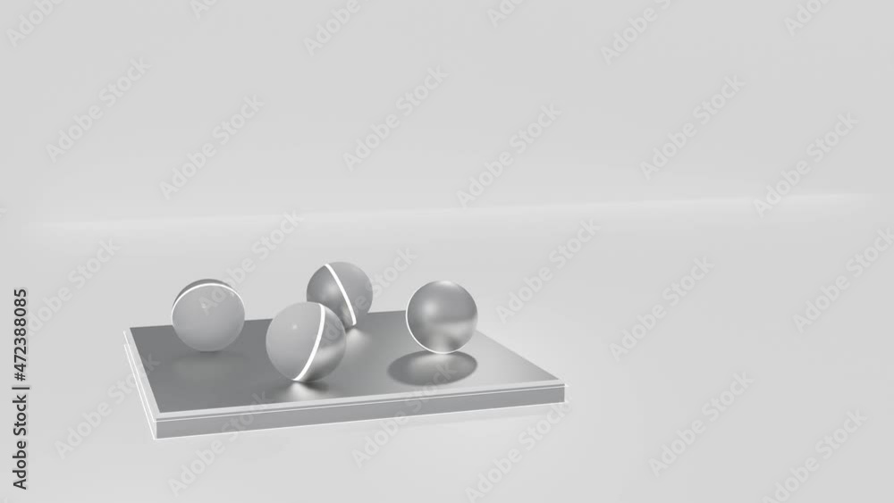 Poster four gray spheres with a luminous stripe roll back and forth on a light-colored metal plate. looped 