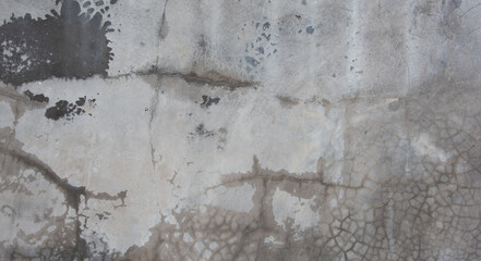 Horizontal dark old cement wall for the background, Texture of a grungy black concrete wall as background.