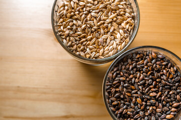 Malt for light and dark beer in glass glasses.