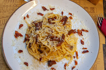 Pasta alla carbonara is a characteristic dish of Lazio, and more particularly of Rome, prepared with popular ingredients such as eggs, pecorino cheese and pepper and with an intense flavor.