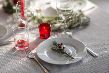 winter holidays, dinner party and celebration concept - close up of christmas table serving at home