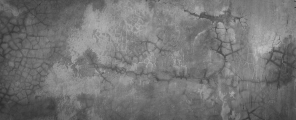 Horizontal dark old cement wall for the background, Texture of a grungy black concrete wall as background.