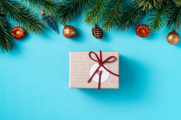 Christmas background design concept with gift box and fir tree branch decoration