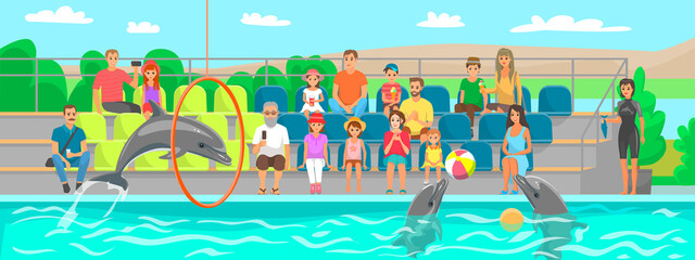 Dolphin showing trick, jumping through hoop in dolphinarium. Dolphin plays, does tricks for spectators. Show on water, performance in oceanarium. Viewers watch marine mammal performing in pool