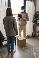 health protection, mail service and pandemic concept - delivery man in face protective mask with parcel box and tablet pc computer and female customer at home