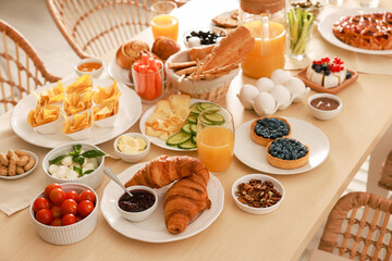 Dishes with different food on table indoors. Luxury brunch