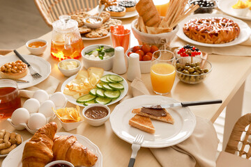 Dishes with different food on table indoors. Luxury brunch