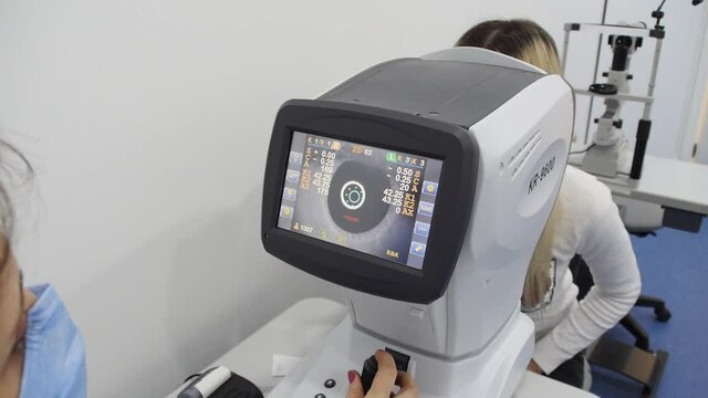 Ophthalmologist office in the hospital. A girl at an ophthalmologists appointment. Vision examination process.