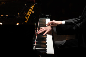Fototapeta na wymiar Photo of a professional pianist playing the piano.