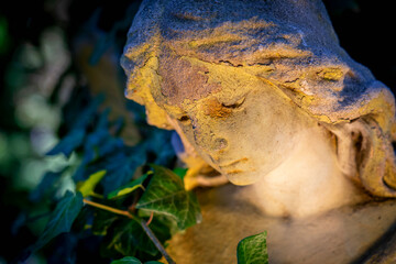 Beautiful sad guardian angel. Fragment of an ancient statue.