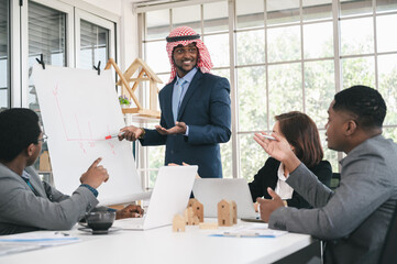 Smart businessmen with Arabian work present and team in office 