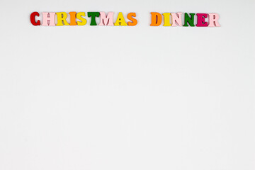 Christmas Dinner menu template on white background. Copy space for text. Christmas menu background concept. Design card for a restaurant menu for a Christmas evening. Colorful letters. Close-up