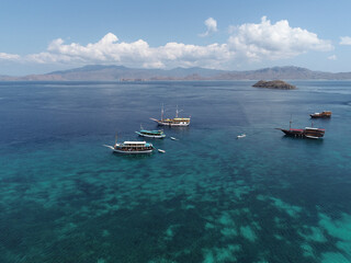 Anchored ship in front of beautiful Long Pink Beach at Labuan Bajo